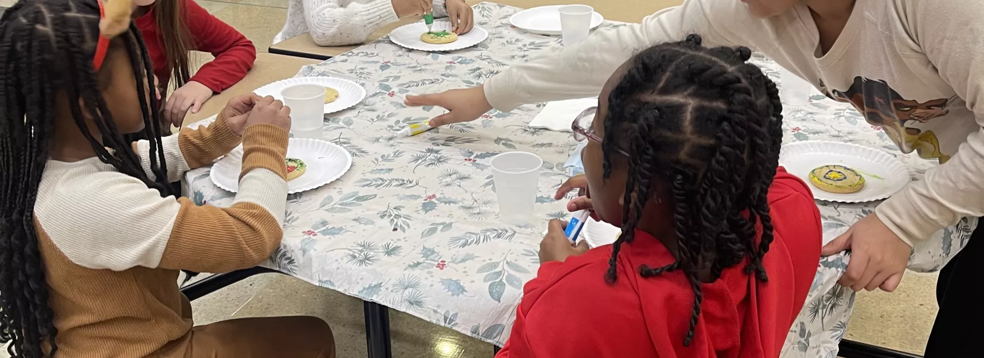 Staff and kids working on a project